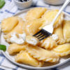 pierogi pierogis dumplings Perogie, pirogi, pirohy, pyrohy, pyrogy, varenyky, vareniki, peroge ravioli luszka empanadas skwarki smietana ser apple butter cabbage kapusta grzyby mushrooms homemade potato