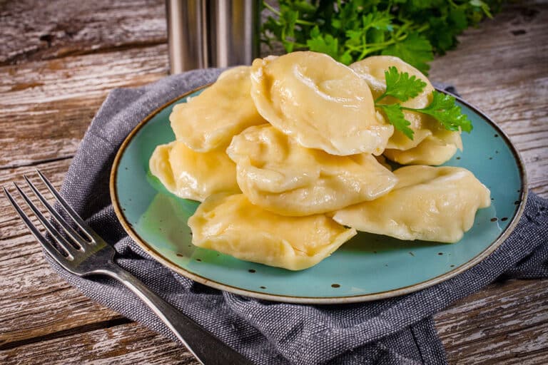 pierogis Hand-made dumplings on plate. Selective focus. pierogie